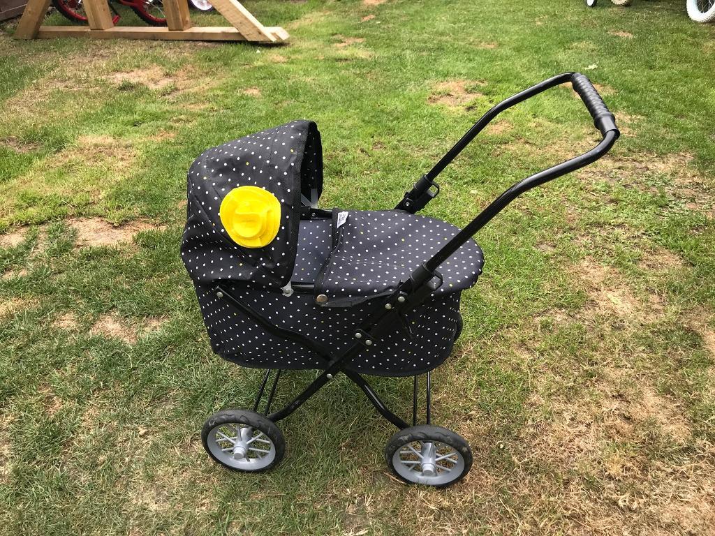 yellow dolls pram